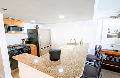 Stainless Steel Appliances in Open Kitchen        