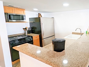 Stainless Steel Appliances in Open Kitchen        