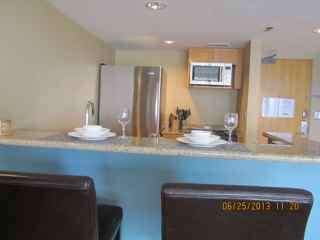 Modern kitchen with fridge/freezer, stove/oven etc
