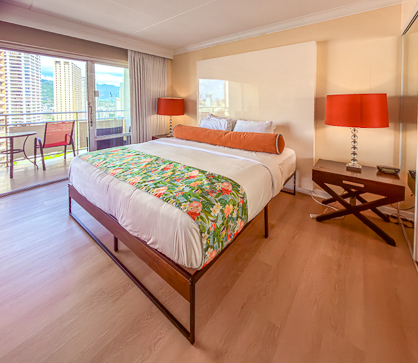 King Bed with Tropical Decor and City View