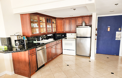 Open Kitchen w/ Dishwasher and Entry Door         