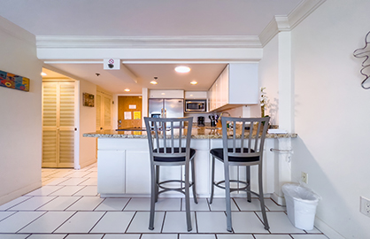 Kitchen with Breakfast Bar and Entrance           